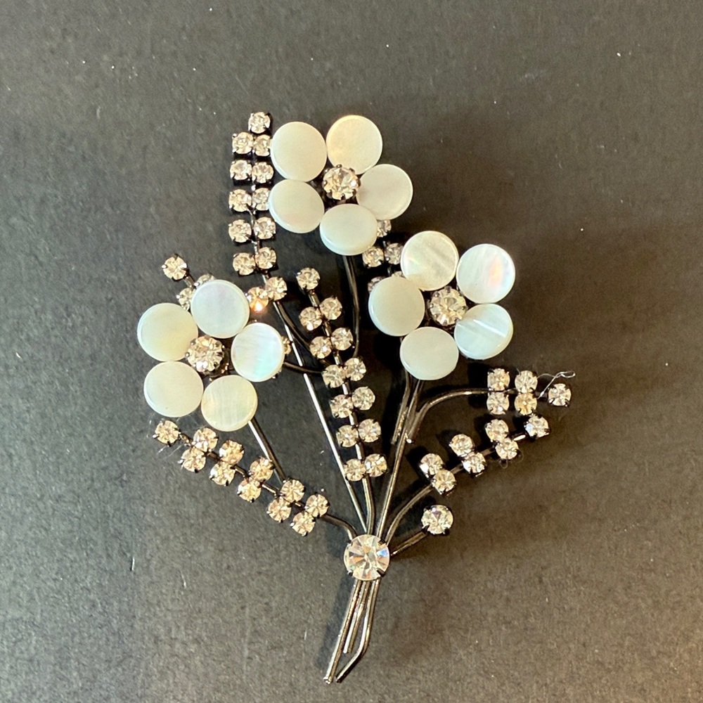 Elegant Floral Brooch with White and Silver Accents